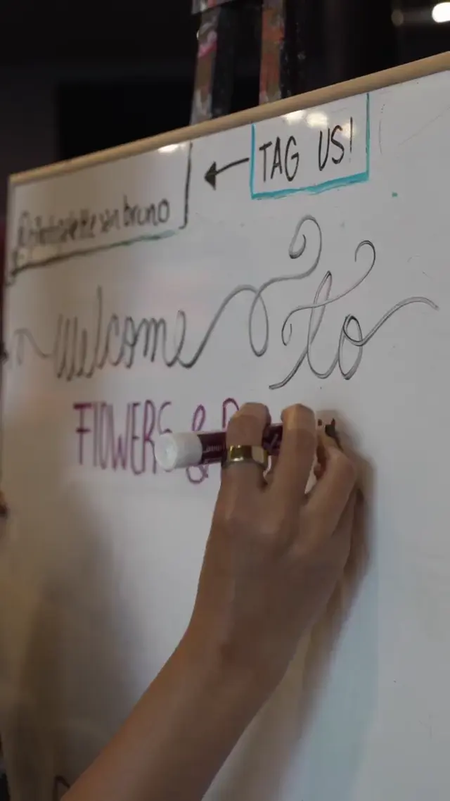 A hand lettering the studio class sign