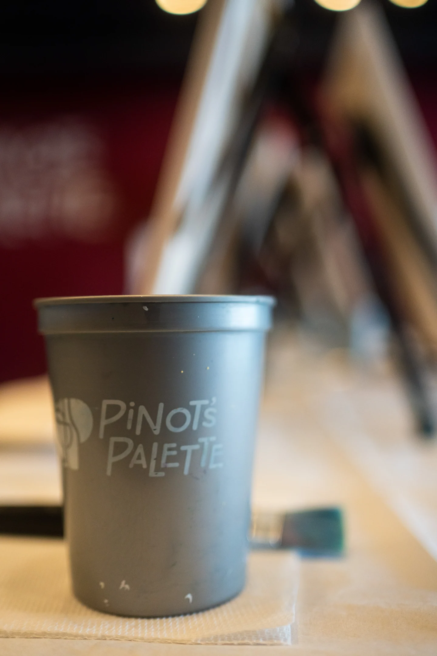 A branded Pinot’s Palette cup in the studio