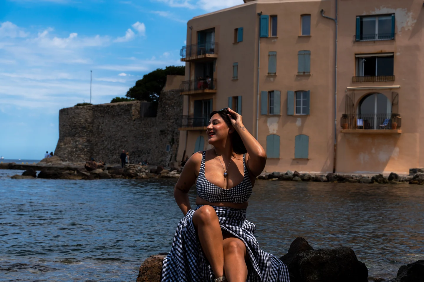 Andrea seated overlooking the coast